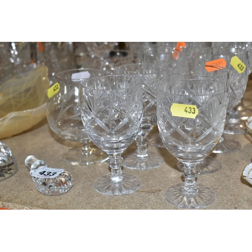 433 - A GROUP OF CUT CRYSTAL, comprising three Dartington Crystal wine glasses, an apricot coloured Murano... 