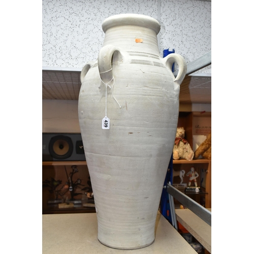 439 - A LARGE TUNISIAN CLAY AMPHORA/URN, rustic handmade with four handles, height 74cm (1) (Condition Rep... 