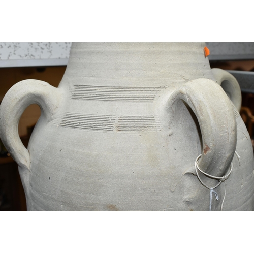 439 - A LARGE TUNISIAN CLAY AMPHORA/URN, rustic handmade with four handles, height 74cm (1) (Condition Rep... 