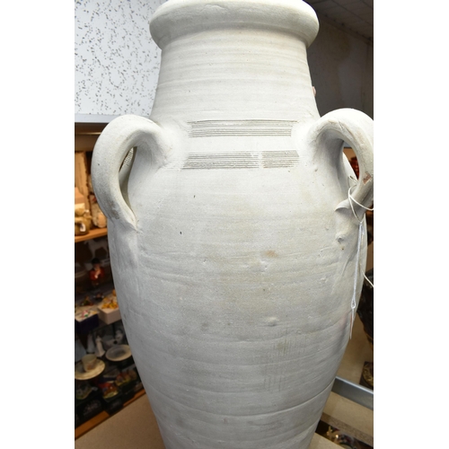 439 - A LARGE TUNISIAN CLAY AMPHORA/URN, rustic handmade with four handles, height 74cm (1) (Condition Rep... 