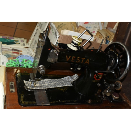 447 - TWO VINTAGE SEWING MACHINES AND A QUANTITY OF SEWING PATTERNS, to include a wooden cased Singer sewi... 