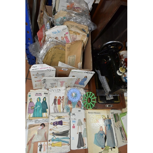 447 - TWO VINTAGE SEWING MACHINES AND A QUANTITY OF SEWING PATTERNS, to include a wooden cased Singer sewi... 