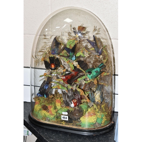 454 - TAXIDERMY: A VICTORIAN GLASS DOME OF HUMMINGBIRDS AND OTHER EXOTIC BIRDS, approximate height 55cm x ... 