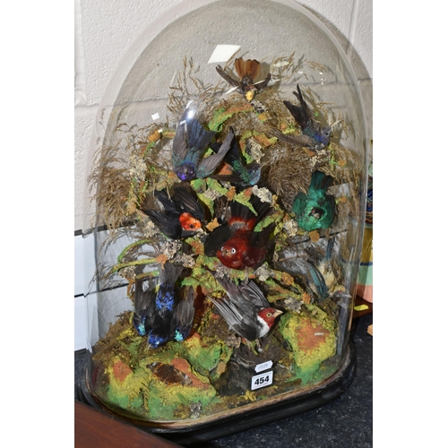 454 - TAXIDERMY: A VICTORIAN GLASS DOME OF HUMMINGBIRDS AND OTHER EXOTIC BIRDS, approximate height 55cm x ... 