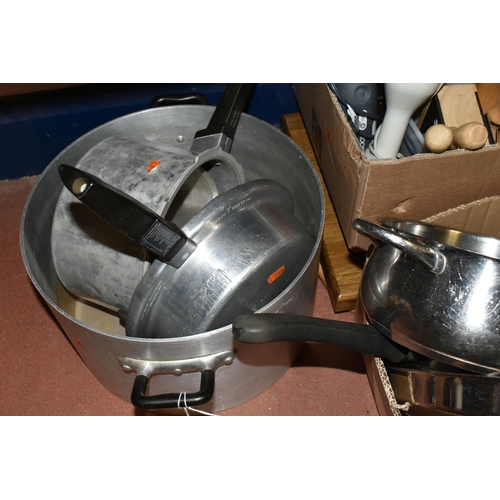 470 - THREE BOXES OF KITCHENWARE, to include stainless steel saucepans, wok, paella pan, serving trays, ha... 