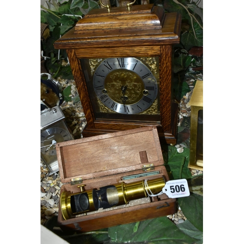 506 - A DRUM MICROSCOPE, A MANTEL CLOCK AND TWO CARRIAGE CLOCKS, comprising a drum microscope in its woode... 