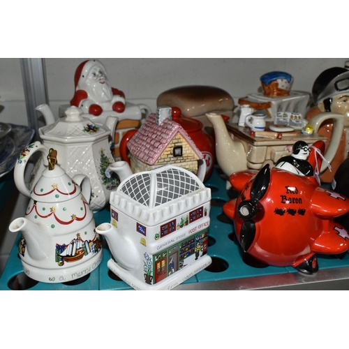 520 - NINETEEN NOVELTY AND DECORATIVE TEAPOTS, to include  a Carlton Ware 'Red Baron' teapot and another C... 