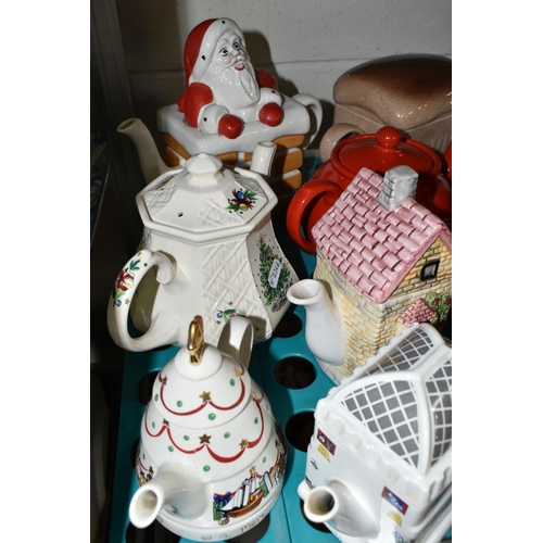 520 - NINETEEN NOVELTY AND DECORATIVE TEAPOTS, to include  a Carlton Ware 'Red Baron' teapot and another C... 