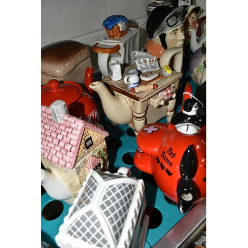 520 - NINETEEN NOVELTY AND DECORATIVE TEAPOTS, to include  a Carlton Ware 'Red Baron' teapot and another C... 