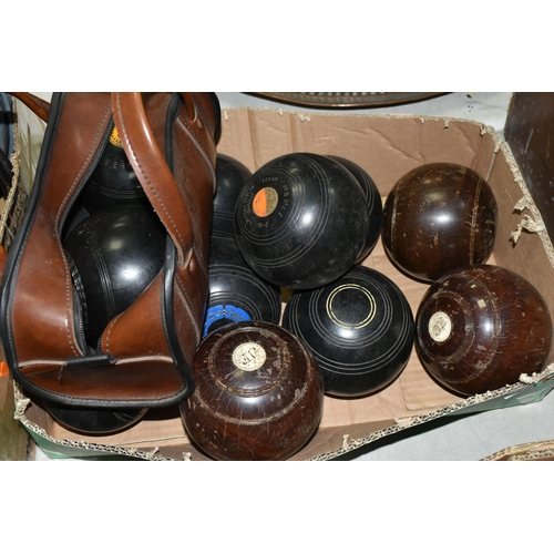 544 - A BOX CONTAINING TWELVE CROWN GREEN BOWLING BALLS IN WOOD EFFECT AND BLACK PLASTIC, two by Thomas Ta... 