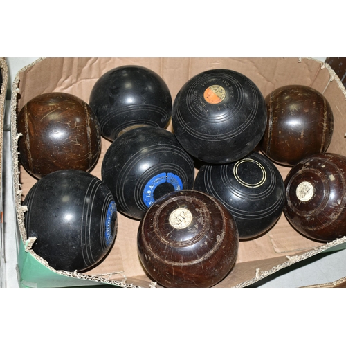 544 - A BOX CONTAINING TWELVE CROWN GREEN BOWLING BALLS IN WOOD EFFECT AND BLACK PLASTIC, two by Thomas Ta... 