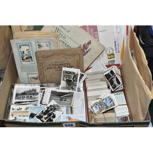 556 - EPHEMERA, one box containing a collection of cigarette cards, loose and in '1d' albums, 1st day cove... 