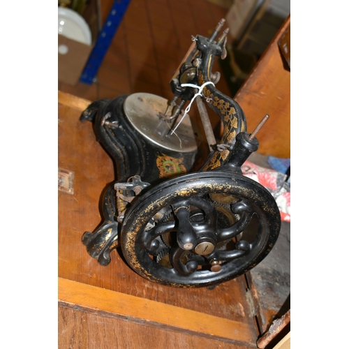 565 - A CASED JONES HAND SEWING MACHINE, swan neck, in black with rubbed gilt decoration, some paint loss ... 