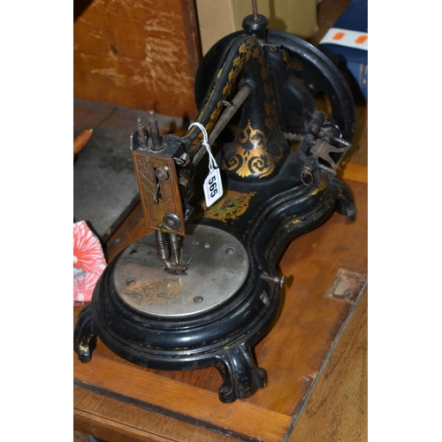 565 - A CASED JONES HAND SEWING MACHINE, swan neck, in black with rubbed gilt decoration, some paint loss ... 