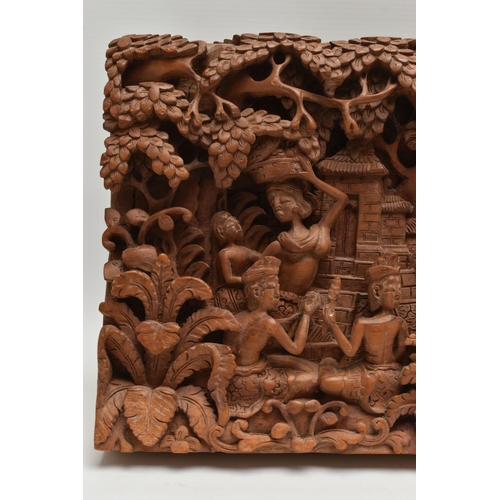 135A - A SECOND HALF 20TH CENTURY BALINESE HIGH RELIEF CARVED RECTANGULAR TEAK PANEL, depicting figures and... 