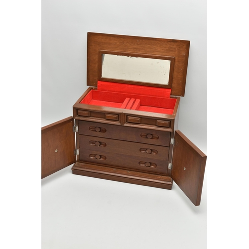 210A - A LATE 20TH CENTURY WALNUT AND TEAK JEWELLERY CASKET, the hinged top opening to reveal a mirror and ... 