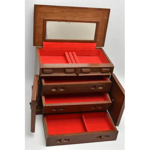 210A - A LATE 20TH CENTURY WALNUT AND TEAK JEWELLERY CASKET, the hinged top opening to reveal a mirror and ... 