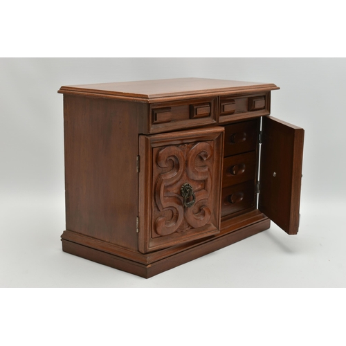 210A - A LATE 20TH CENTURY WALNUT AND TEAK JEWELLERY CASKET, the hinged top opening to reveal a mirror and ... 