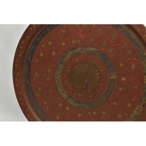 215A - A MID 20TH CENTURY INDIAN BRASS TRAY WITH ENAMELLED AND ENGRAVED DECORATION, with a peacock design t... 