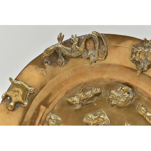 225A - A LATE 19TH CENTURY BRASS PLATTER APPLIED WITH CAST BRASS REPTILES, INSECTS, ANIMALS AND FIGURES, in... 