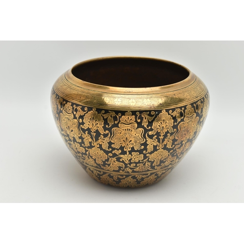 235A - AN INDIAN HEAVY BRASS AND BLACK ENAMELLED JARDINIERE, engraved with a foliate design of stylised lot... 