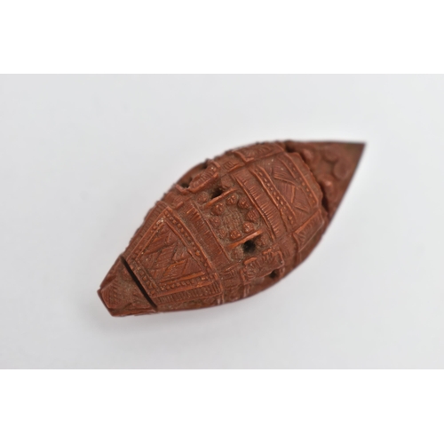 55A - A CHINESE HEDIAO NUT CARVED AS A BOAT, inscribed verso with Chinese script / poem, Qing period, leng... 