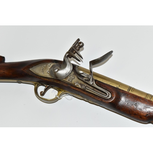 202 - AN OLD REPLICA OF A BRASS BARREL FLINTLOCK BLUNDERBUSS, only bored through for part of its barrel le... 