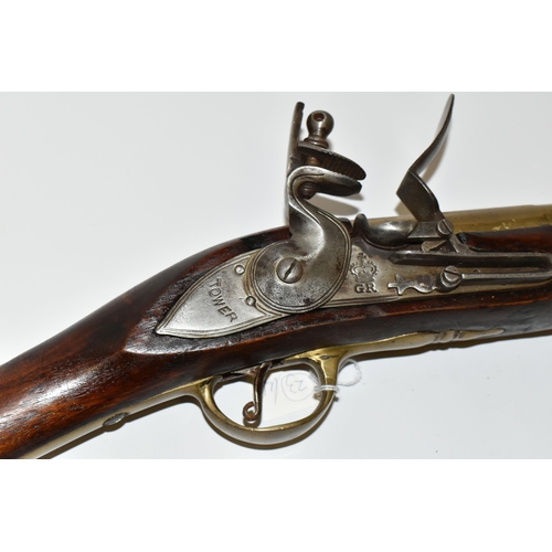 202 - AN OLD REPLICA OF A BRASS BARREL FLINTLOCK BLUNDERBUSS, only bored through for part of its barrel le... 