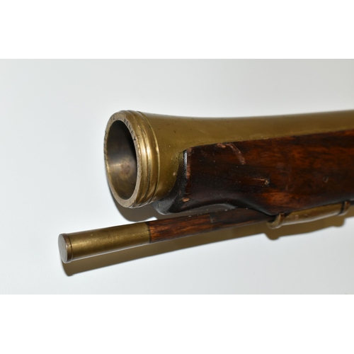 202 - AN OLD REPLICA OF A BRASS BARREL FLINTLOCK BLUNDERBUSS, only bored through for part of its barrel le... 