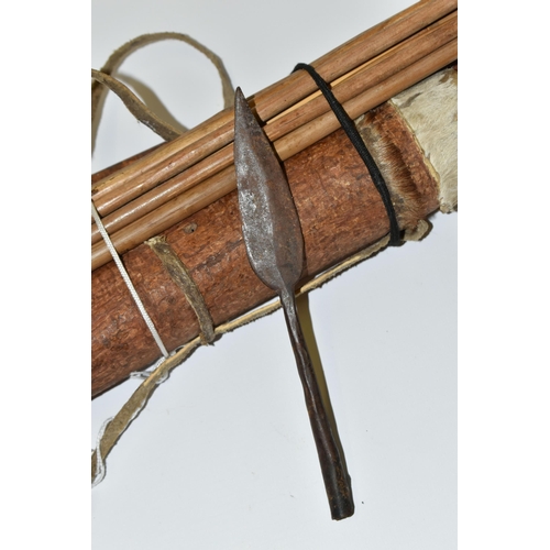 204 - A VERY INTERESTING LONG BOW, ARROWS AND QUIVER OF NATIVE ORIGINS, the quiver is made from a hollowed... 