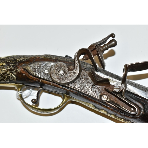 216 - AN ANTIQUE 20 BORE TURKISH FLINTLOCK HOLSTER PISTOL FITTED WITH A 12'' BARREL, its stock is nicely i... 