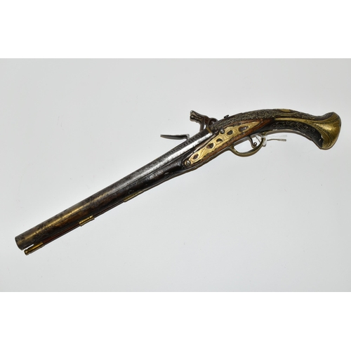 216 - AN ANTIQUE 20 BORE TURKISH FLINTLOCK HOLSTER PISTOL FITTED WITH A 12'' BARREL, its stock is nicely i... 