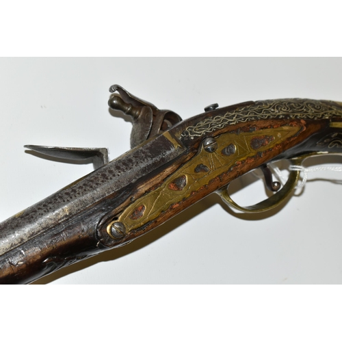 216 - AN ANTIQUE 20 BORE TURKISH FLINTLOCK HOLSTER PISTOL FITTED WITH A 12'' BARREL, its stock is nicely i... 