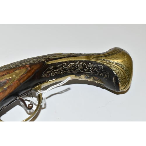 216 - AN ANTIQUE 20 BORE TURKISH FLINTLOCK HOLSTER PISTOL FITTED WITH A 12'' BARREL, its stock is nicely i... 