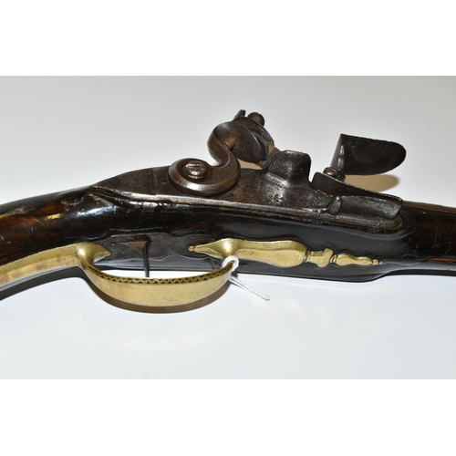 219 - AN ANTIQUE 15 BORE FLINTLOCK HOLSTER PISTOL FITTED WITH A 9¾'' BARREL, it bears London Proof marks a... 