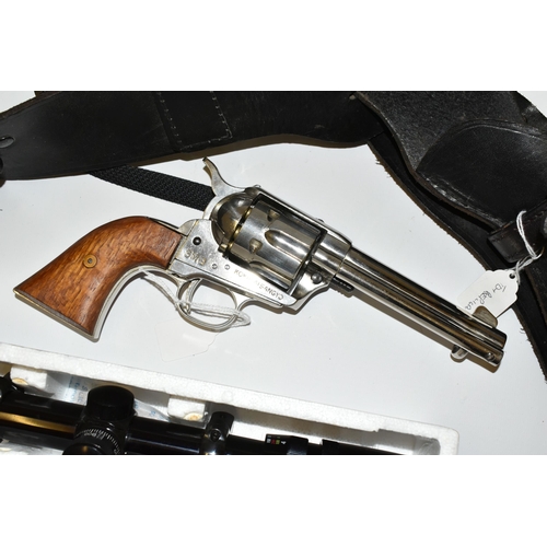 233 - A REPLICA SMG WHITE METAL NON FIRING COPY OF A COLT 45 PEACEMAKER, in a leather holster with belt, a... 