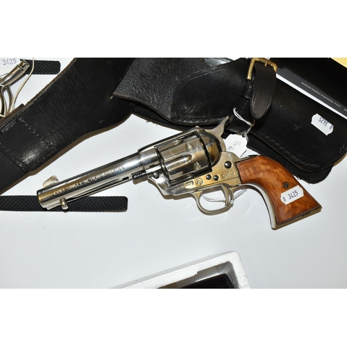 233 - A REPLICA SMG WHITE METAL NON FIRING COPY OF A COLT 45 PEACEMAKER, in a leather holster with belt, a... 