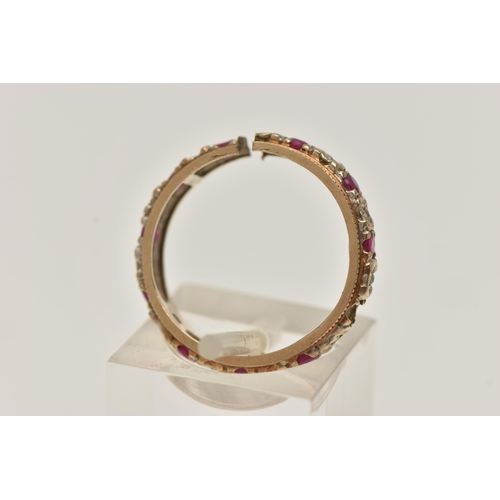 100 - A 9CT GOLD FULL ETERNITY RING, AF split shank, missing a ruby, set with rubies and single cut diamon... 