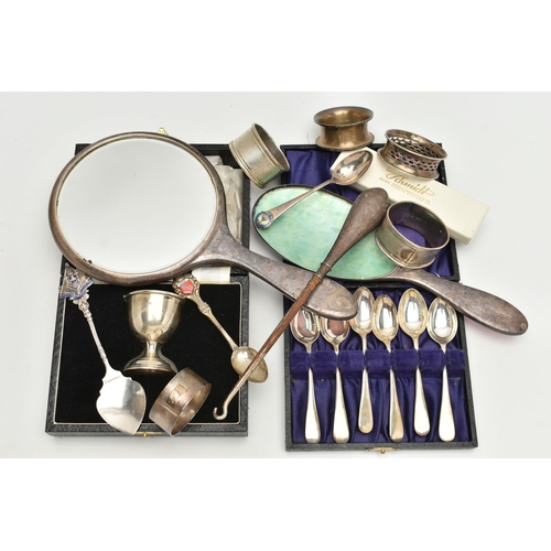 115 - AN ASSORTMENT OF SILVER ITEMS, to include a cased egg cup, a cased set of six teaspoons, four assort... 