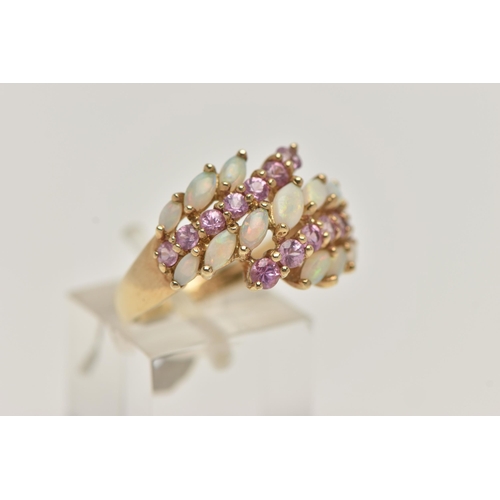 22 - A 9CT GOLD OPAL AND PINK SAPPHIRE DRESS RING, designed with two rows of asymmetrically set circular ... 