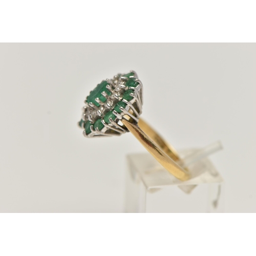 24 - AN 18CT GOLD EMERALD AND DIAMOND CLUSTER RING, oval cluster set with a central oval cut emerald, in ... 