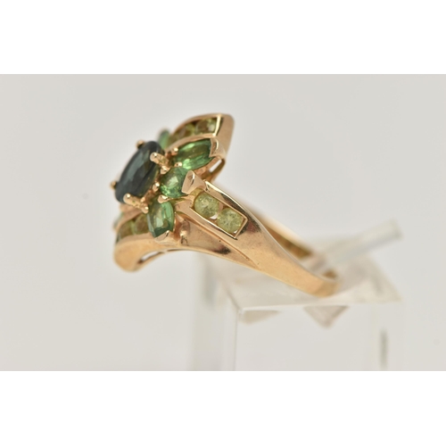 34 - A 9CT GOLD GEM SET RING, dress ring set with a central oval cut green sapphire, within a surround of... 