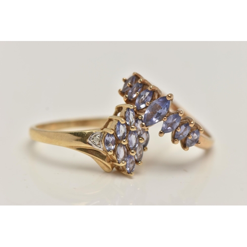 38 - TWO 9CT GOLD GEM SET RINGS, the first set with a row of marquise cut tanzanite, to a polished band, ... 