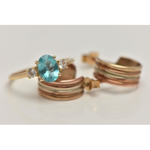 40 - A 14CT GOLD RING AND A PAIR OF HOOP EARRINGS, the ring set with a central oval cut light blue stone,... 