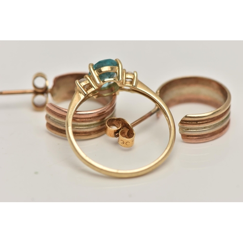 40 - A 14CT GOLD RING AND A PAIR OF HOOP EARRINGS, the ring set with a central oval cut light blue stone,... 