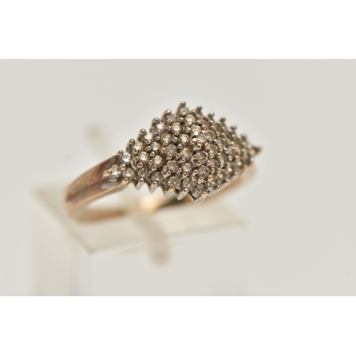 62 - A DIAMOND CLUSTER RING, forty nine single cut diamonds, prong set in white metal, leading on to a ye... 