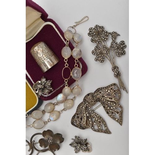 72 - A BAG OF ASSORTED JEWELLERY, to include a white metal marcasite bow brooch, an AF white metal moonst... 