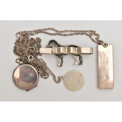 74 - THREE PENDANT NECKLACES AND A TIE CLIP,  to include a silver ingot hallmarked London, suspended from... 