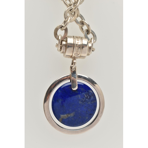 77 - A SILVER LAPIS LAZULI PENDANT NECKLACE, circular polished lapis lazuli pendant, fitted to a Rolo lin... 