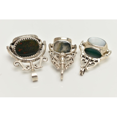 84 - THREE WHITE METAL SWIVEL FOB PENDANTS, each set with semi-precious gemstones such as bloodstone, car... 